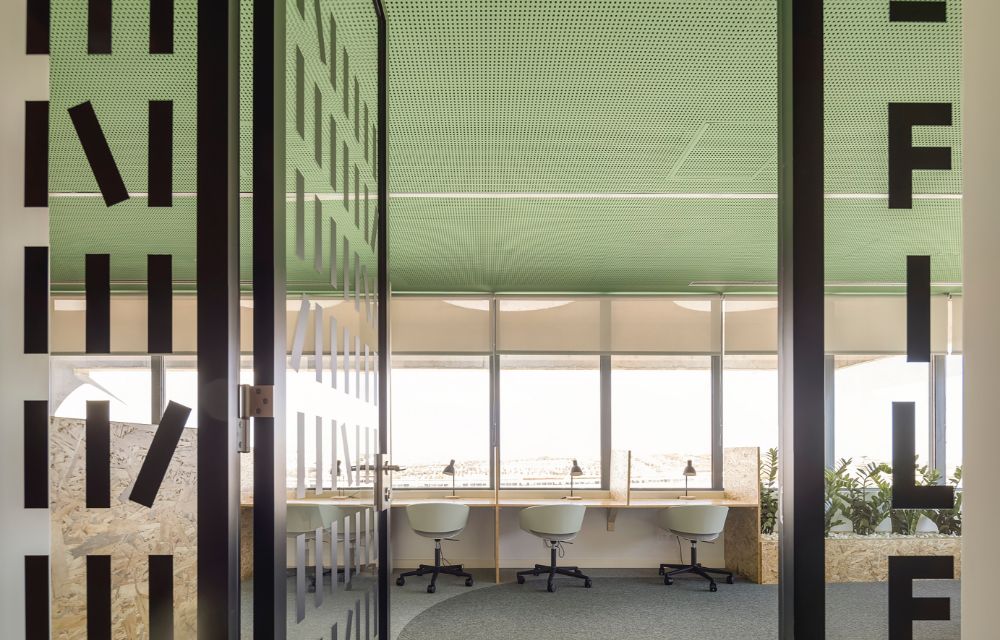 office with green ceiling and panoramic windows